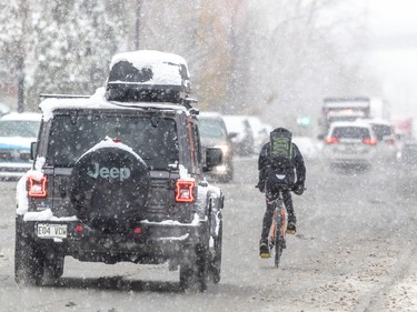 The first snowfall of the year did not stop this cyclist from hitting the streets on Nov. 16, 2022.