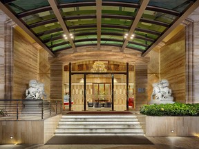 The elegant entrance of Sherwood Suites in Ho Chi Minh City combines traditional and modern looks.