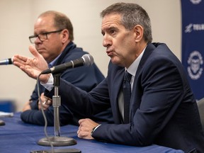Montreal Alouettes general manager and interim head coach Danny Maciocia, left, and team president Mario Cecchini during a news conference in Montreal on Nov.  22, 2022.