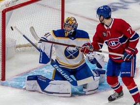 Montreal Canadiens centre Kirby Dach (77) watches the point shot from teammate Cole Caufield (22) find the back of the net against Buffalo Sabres goaltender Craig Anderson (41) during 1st period NHL action at the Bell Centre in Montreal on Tuesday Nov. 22, 2022.