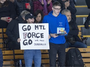 Laurence Milot and Guillaume show their support for the Montreal Force during their first Premier Hockey League home game against the Metropolitan Riveters in Verdun on Saturday, Nov.  26, 2022.