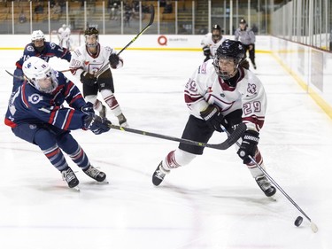 Metropolitan Riveters Kendall Cornine gets her stick up on Montreal Force's Laura Jardin during the Force's first Premier Hockey League home game in Verdun on Saturday, Nov. 26, 2022.