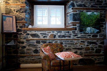 The original stone walls that were covered with drywall have been restored and exposed in the completely renovated Braemar home in Westmount on Dec. 13, 2014.
