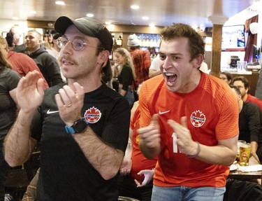 Fans at Montreal's Burgundy Lion pub react as Canada is awarded a penalty kick against Belgium on Nov. 23, 2022