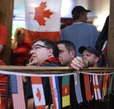 MONTREAL, QUE.: November 23, 2022 -- Soccer fans watch Canada vs Belgium play in the World Cup, Burgundy Lion in Montreal on Wednesday, November 23, 2022.