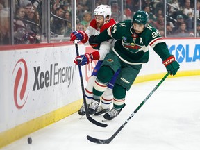 Jonathan Drouin #27 of the Montreal Canadiens and Matt Dumba #24 of the Minnesota Wild compete for the puck in the first period of the game at Xcel Energy Center on Nov. 1, 2022 in St. Paul, Minnesota.