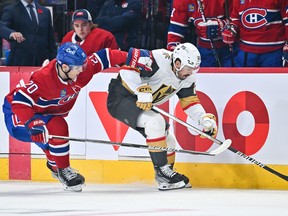 Juraj Slafkovsky of the Montreal Canadiens battles for puck with Chandler Stephenson of the Vegas Golden Knights during the first period at the Bell Centre in Montreal on Nov. 5, 2022.