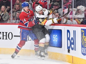 Canadiens' Jordan Harris (54) forces Jonathan Marchessault of the Vegas Golden Knights toward the boards during the first period at the Bell Centre on Saturday, Nov. 5, 2022.