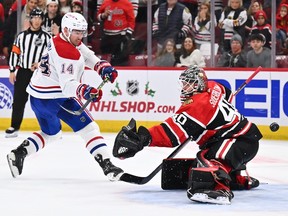 Nick Suzuki of the Montreal Canadiens scores in the shootout on Arvid Soderblom of the Chicago Blackhawks at United Center in Chicago on Nov.  25, 2022.