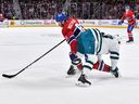 Montreal Canadiens' Mike Matheson battles Noah Gregor of the San Jose Sharks during the second period at the Bell Centre in Montreal on Nov. 29, 2022.