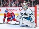 Canadiens forward Evgeny Dadonov lurks nearby during a game at the Bell Center on Tuesday night as Sharks goaltender Kapo Karkonnen prepares to shoot.