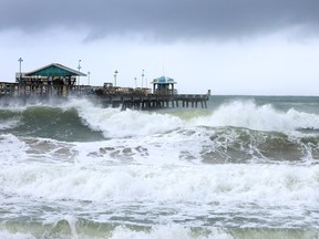 The ocean is whipped up by tropical storm Nicole near Anglin's Fishing Pier on Nov. 9, 2022 in Lauderdale-By-The-Sea, Florida. Tropical storm Nicole could become a Category 1 hurricane before hitting Florida's east coast by early Thursday. Quebec is forecast to see the remnants of Nicole on Friday and Saturday.