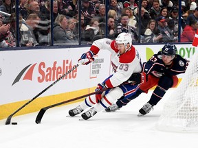 Evgenii Dadonov #63 of the Montreal Canadiens controls the puck against Jake Christiansen #23 of the Columbus Blue Jackets during the first period at Nationwide Arena on Nov. 17, 2022 in Columbus, Ohio.