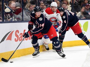 Gustav Nyquist #14 of the Columbus Blue Jackets controls the puck against Nick Suzuki #14 of the Montreal Canadiens during the first period at Nationwide Arena on Nov. 17, 2022 in Columbus, Ohio.