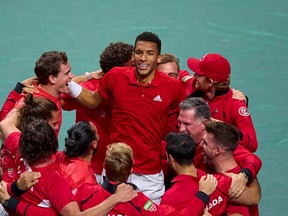 Félix Auger-Aliassime of Montreal celebrates with Canadian team after winning Davis Cup  2022 final singles match between Australia and Canada on Sunday, Nov. 27 in Malaga, Spain.