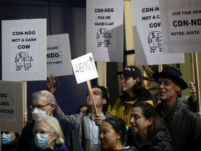Protesters take part in a sidewalk demo against the recent increases in their property valuations   outside the Benny Library, on Tuesday Nov. 1, 2022  where Montreal mayor Valérie Plante was taking part in town-hall meeting.