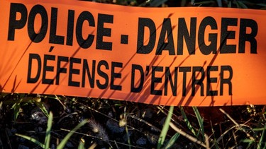Orange police tape that says danger