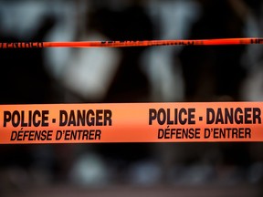 MONTREAL, QUE.: AUGUST 23, 2016 -- Police tape at the scene of a fire in Laval on August 23, 2016.