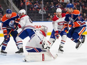 Canadiens goalie Jake Allen makes the save as Edmonton Oilers' Connor McDavid (97) jumps during second-period NHL action in Edmonton on Saturday, Dec. 3, 2022.