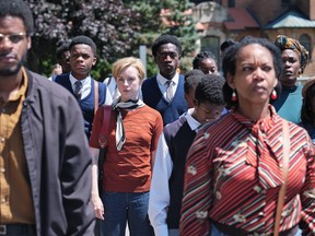 Canadian actress Casey Rolle (center) in a scene from Quebec director Anaïs Barbeau-Lavalette's film Chen Blanc.