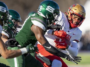 Laval Rouge et Or player Kevin Mital is a popular target as he gets a pass against the University of Saskatchewan Huskies in the first half of the Vanier Cup in London, Ont., on Saturday, Nov. 26, 2022.