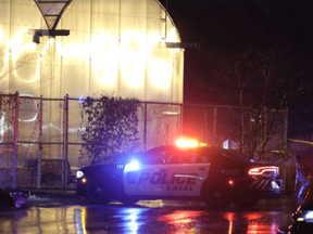 Police at the scene of a shooting Friday night, Nov. 11, 2022, in Laval in a park near Collège Montmorency.