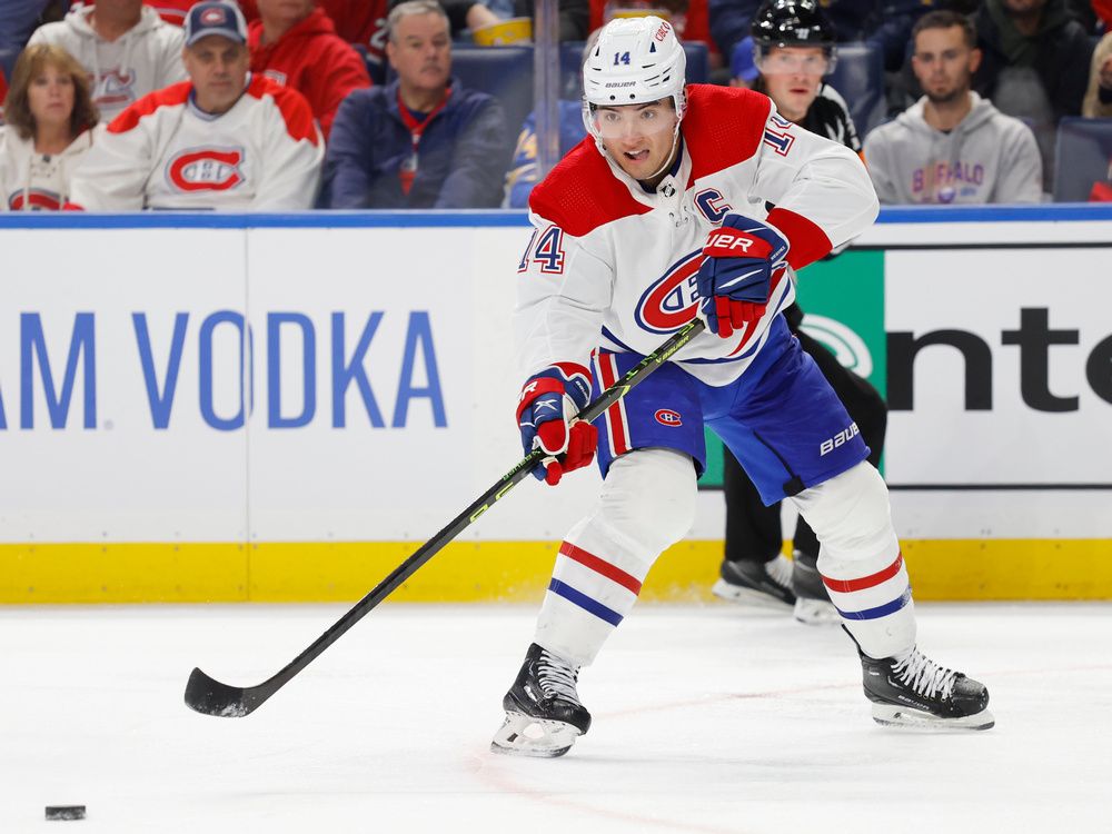 Nick Suzuki wearing the C in full hockey gear : r/Habs