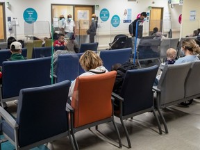 Parents with their children in the Montreal Children’s Hospital emergency waiting room in late October. “Because we didn’t see these viruses in the last few years, we’re seeing them all come together,” says one doctor.