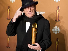 Jean Lapointe holds up his Jutra Award after being honoured at the 2011 Jutra Awards in Montreal on March 13, 2011.