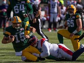 Montreal Alouettes' Almondo Sewell sacks Edmonton Elks quarterback Taylor Cornelius during first half in Edmonton on Oct. 1, 2022.