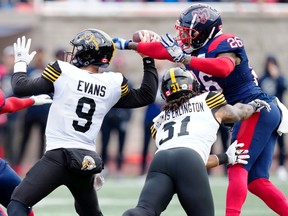 Montreal Alouettes linebacker Tyrice Beverette knocks the ball loose from Hamilton Tiger-Cats quarterback Dane Evans as Sean Thomas Erlington tries to block during first quarter of Eastern semifinal in Montreal on Nov. 6, 2022.