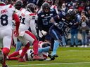 The Toronto Argonauts backed by Andrew Harris (33) will score a touchdown against the Montreal Alouettes on Sunday, November 13, 2022 at BMO Field in Toronto.