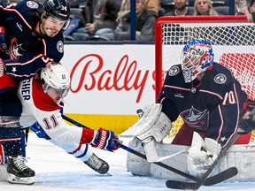 The Canadiens’ Brendan battles for the puck while getting knocked down by the Columbus Blue Jackets’ Cole Sillinger during game at Nationwide Arena on Nov. 17. The Blue Jackets won the game 6-4.