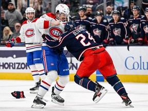 Montreal Canadiens defenceman Arber Xhekaj (72) and Columbus Blue Jackets right wing Mathieu Olivier (24) fight at the end of the second period at Nationwide Arena in Columbus, Ohio, on Nov. 17, 2022.
