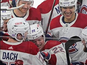 Canadiens' Kirby Dach (77) celebrates the game-winning goal against the Chicago Blackhawks during a shootout at United Center in Chicago on Friday, Nov. 25, 2022.