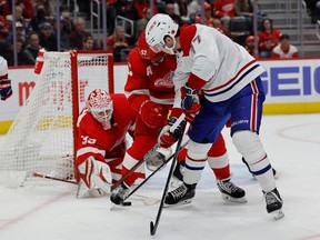 Detroit Red Wings goaltender Ville Husso (35) makes a save on Montreal Canadiens centre Kirby Dach (77) in the third period at Little Caesars Arena in Detroit on Nov. 8, 2022.