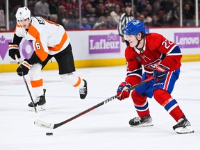 Canadiens right-winger Cole Caufield plays the puck against the Philadelphia Flyers during overtime at the Bell Centre in Montreal on Nov. 19, 2022.