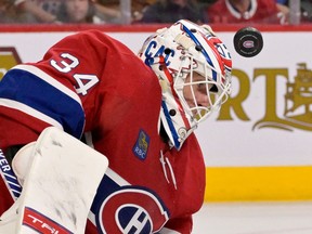 Montreal Canadiens goalie Jake Allen gets hit in the mask during the third period against the Pittsburgh Penguins at the Bell Centre in Montreal on Nov. 12, 2022.