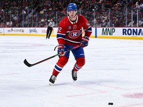 Montreal Canadiens defenceman Justin Barron plays the puck at the Bell Centre in Montreal on Oct. 3, 2022.