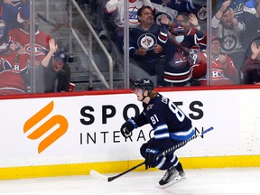 Fans celebrate the overtime goal by Winnipeg Jets left wing Kyle Connor (81) against the Montreal Canadiens at Canada Life Centre in Winnipeg on Thursday, Nov. 3, 2022.