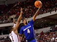 Hofstra guard Aaron Estrada drives past Arkansas guard J.D. Notae during the second half on Dec. 18, 2021, in Little Rock, Ark.