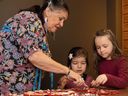 Huron cultural guide Diane Andicha-Picard leads a workshop in crafting Indigenous jewellery.