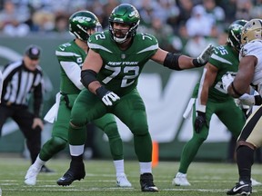 New York Jets guard Laurent Duvernay-Tardif blocks during an NFL football game against the New Orleans Saints, Sunday, Dec. 12, 2021, in East Rutherford, N.J.