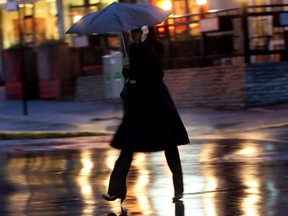 On a damp Nov. 14 in 2006, a woman crosses Monkland Ave. in N.D.G.