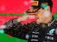 Mercedes' George Russell celebrates on the podium after winning the Brazilian Grand Prix at Jose Carlos Pace Circuit, Sao Paulo, on Sunday, Nov. 13, 2022.