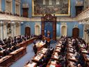 Quebec Prime Minister Francois Legault (left) delivers a speech during his inaugural address before the Quebec City Parliament on Wednesday, November 28, 2018.