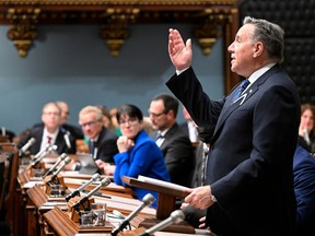 Quebec Premier François Legault points to the gallery as he stands to present the inaugural speech, at the National Assembly in Quebec City, Wednesday, Nov. 30, 2022.