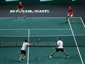 Kevin Krawietz and Tim Puetz of Germany play against Canada's Vasek Posposil and Denis Shapovalov during a Davis Cup quarter-final tennis match between Germany and Canada in Malaga, Spain, Thursday, Nov. 24, 2022.