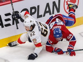 Jordan Harris  of the Montreal Canadiens and Brandon Montour of the Florida Panthers collide in N.H.L. action at the Bell Centre in Montreal Friday, April 29, 2022.