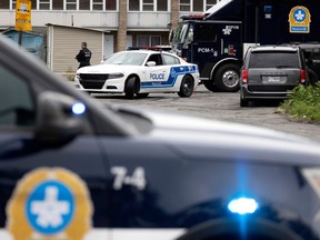 Montreal police, along with SQ and BEI investigators, are seen at Motel Pierre on Aug. 4, 2022.